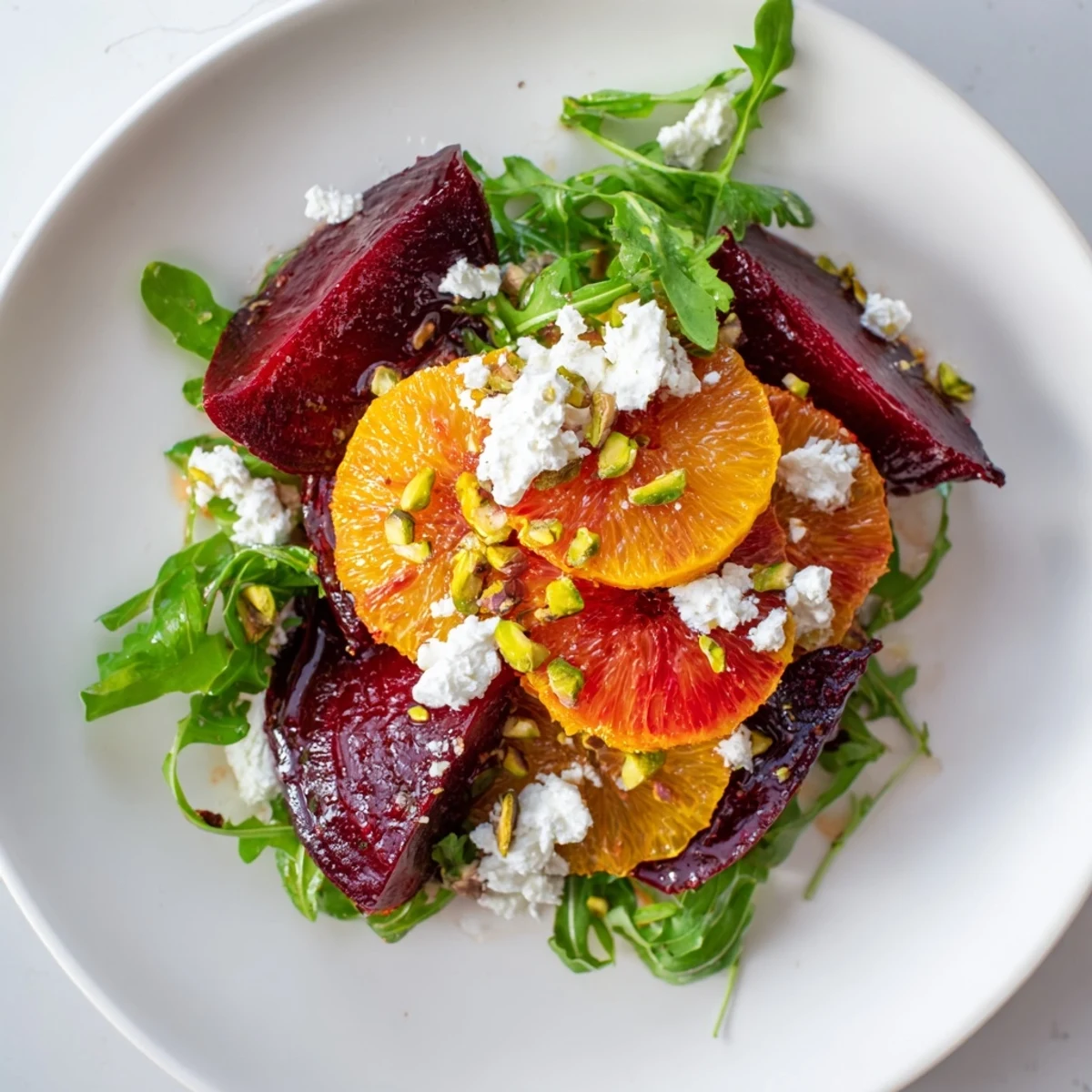Close-up of a Roasted Beet and Blood Orange Salad, ready to eat with a dynamic citrus vinaigrette dressing.