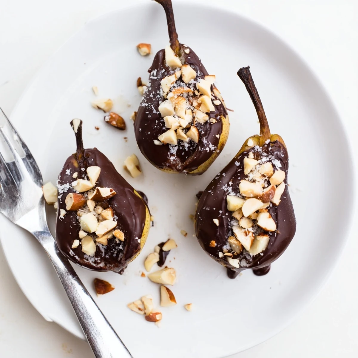 Fresh Chocolate Covered Pears served chilled, with rich dark chocolate, toasted nuts, and flaky sea salt on a rustic platter.
