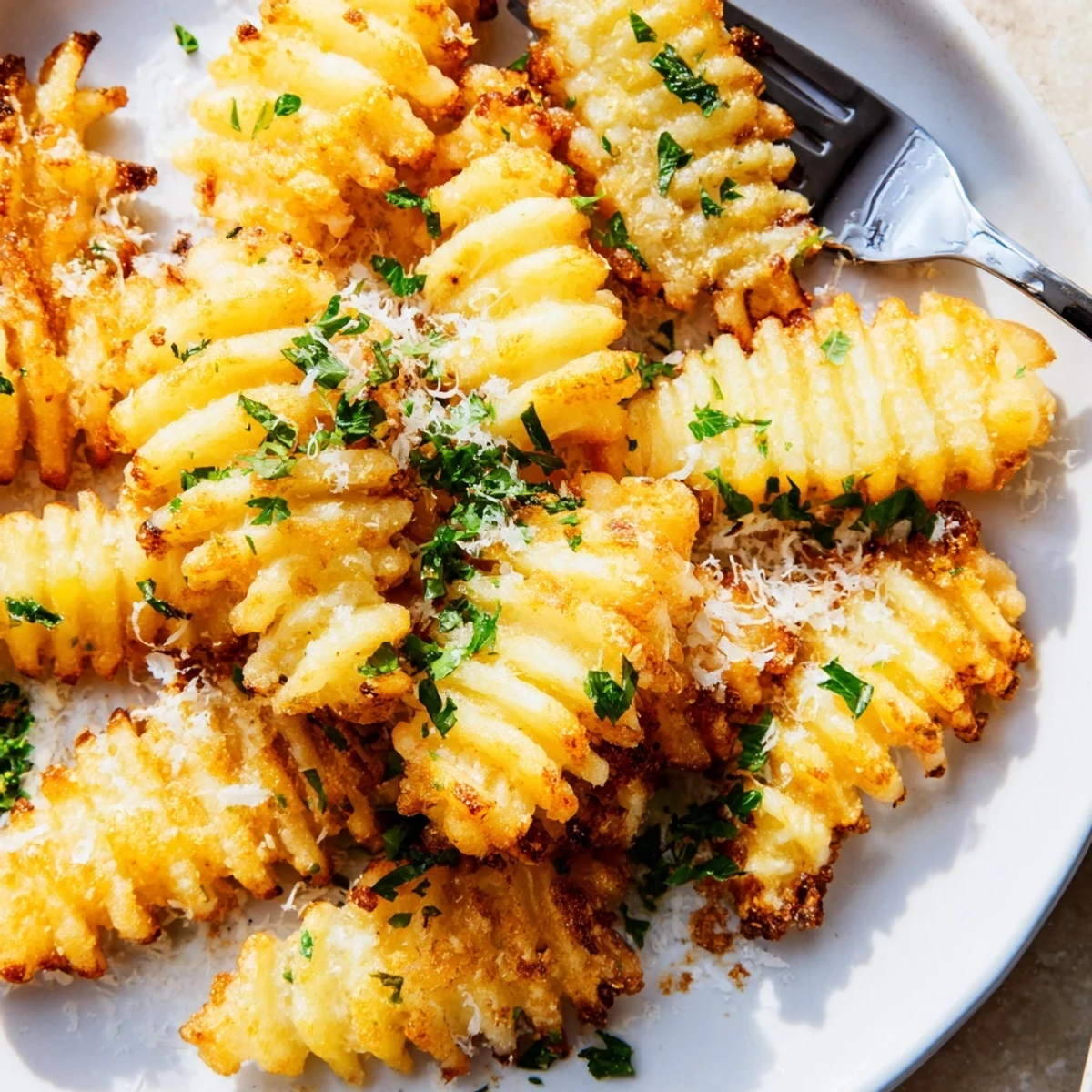 Freshly baked Crispy Mashed Potato Fries stacked high, ready to be dipped in creamy aioli sauce.
