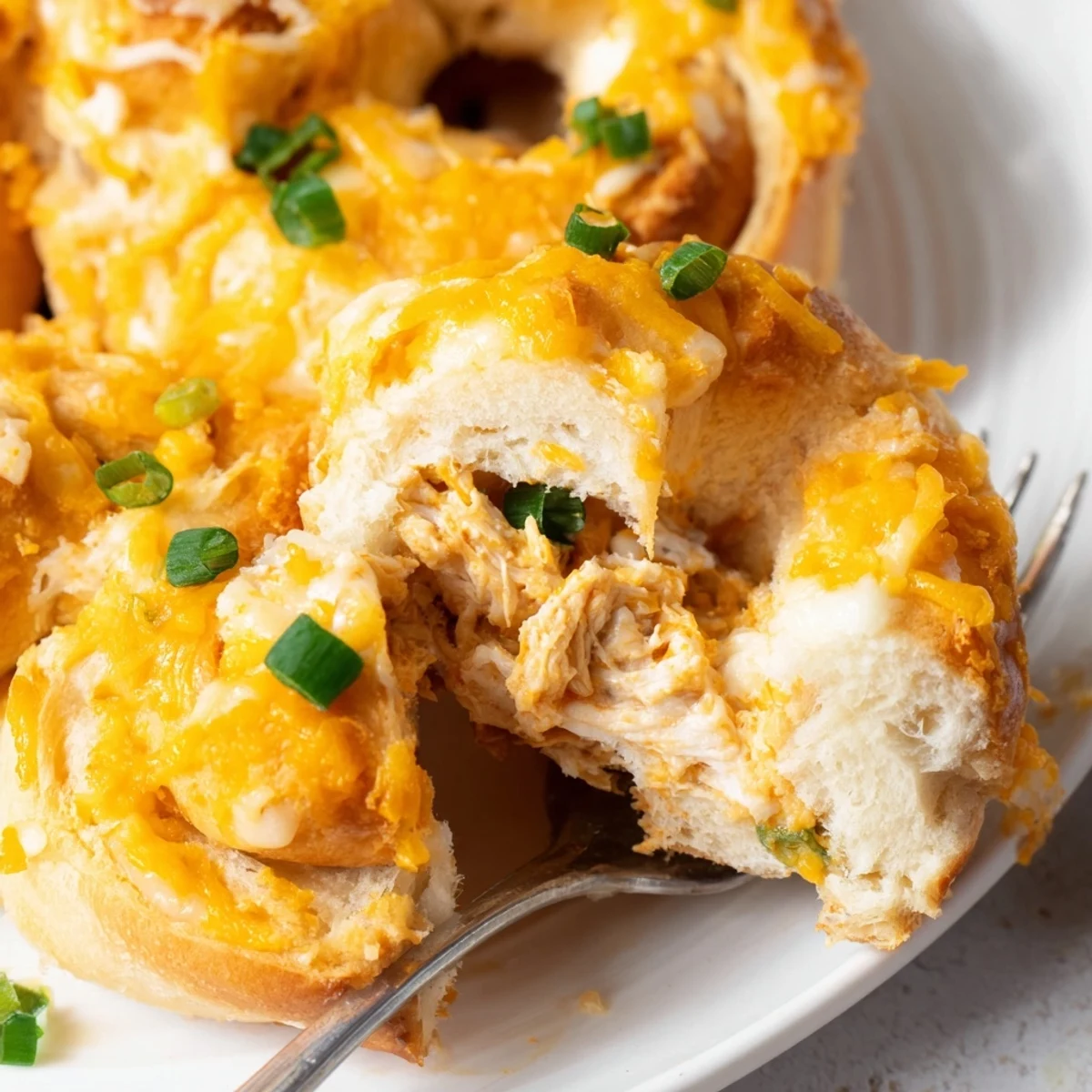 Golden brown cheesy chicken crescent bake with bubbling cheese and flaky pastry crust