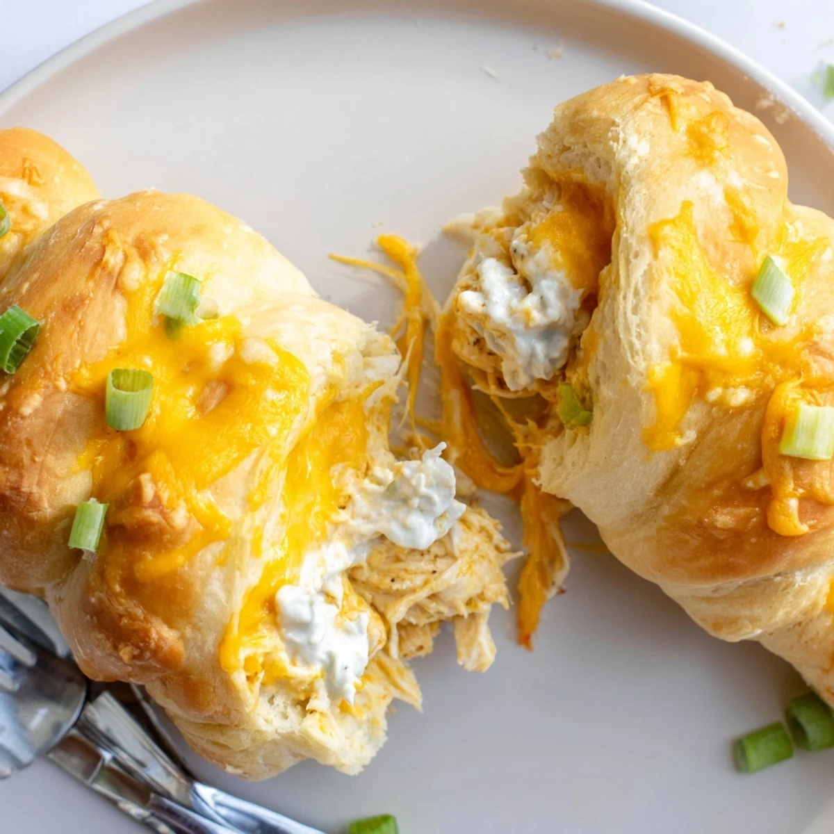 Creamy chicken and cheddar filling wrapped inside buttery crescent rolls fresh from the oven