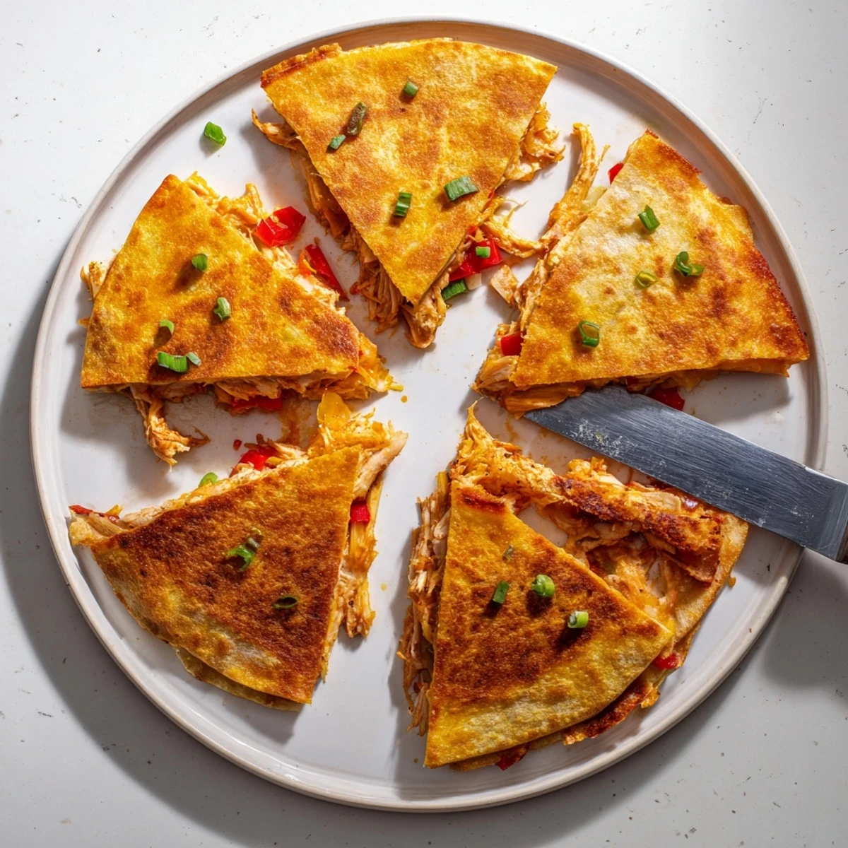 Golden baked chicken and cheese quesadillas with melted cheese and colorful bell peppers