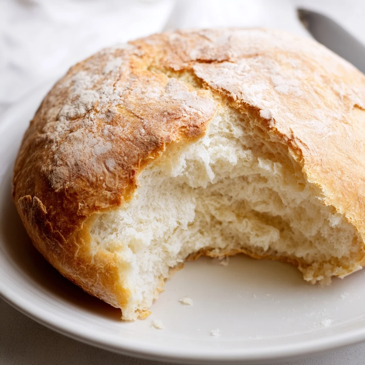Warm skillet bread pieces brushed with olive oil, ready for serving on a plate