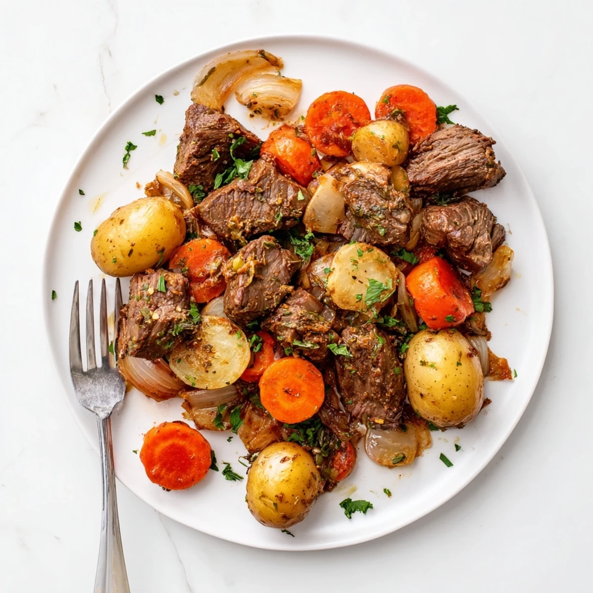 Tender beef steaks and baby potatoes cooked low and slow in a crockpot with savory broth