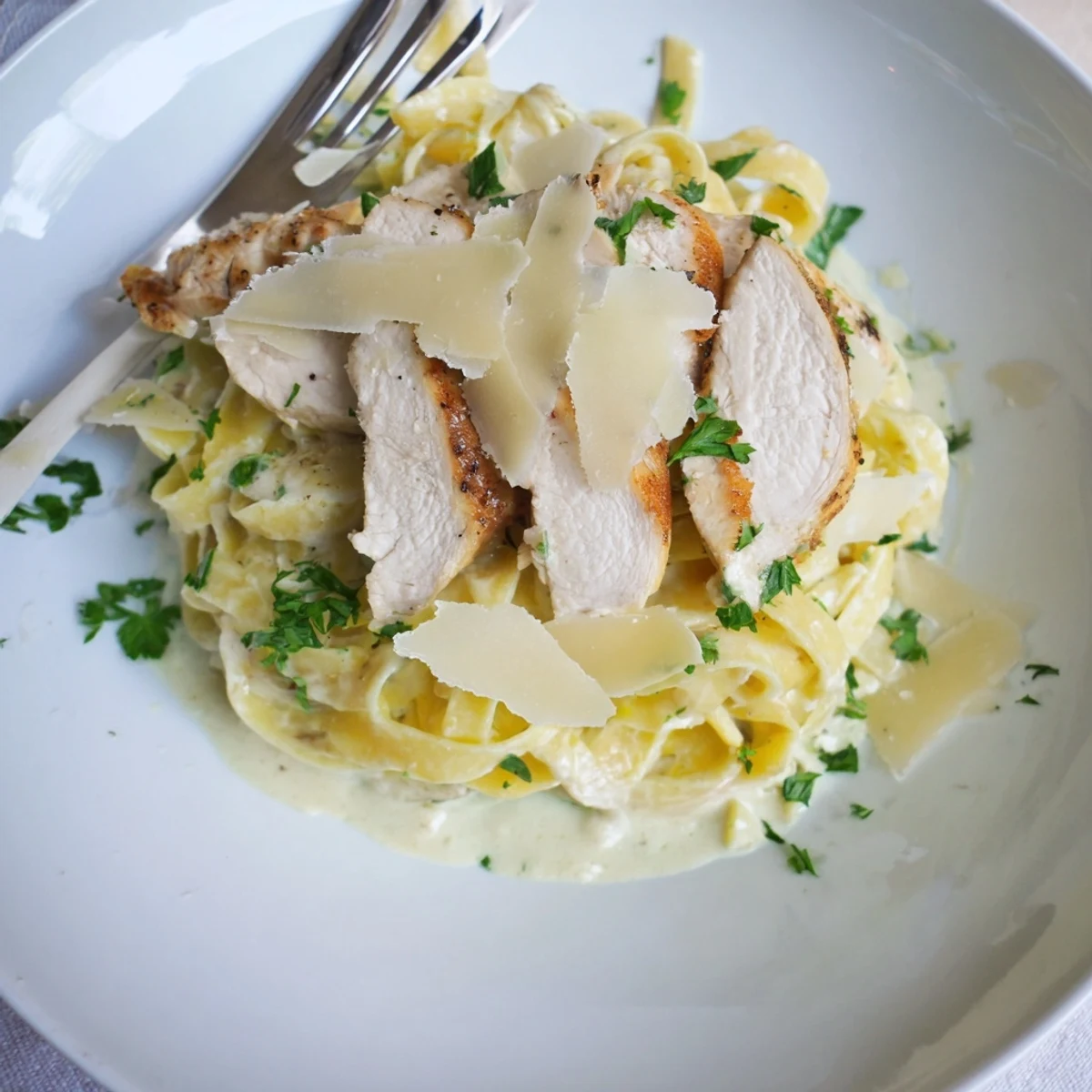 Creamy Garlic Chicken Pasta with golden-seared chicken, silky sauce, parsley garnish