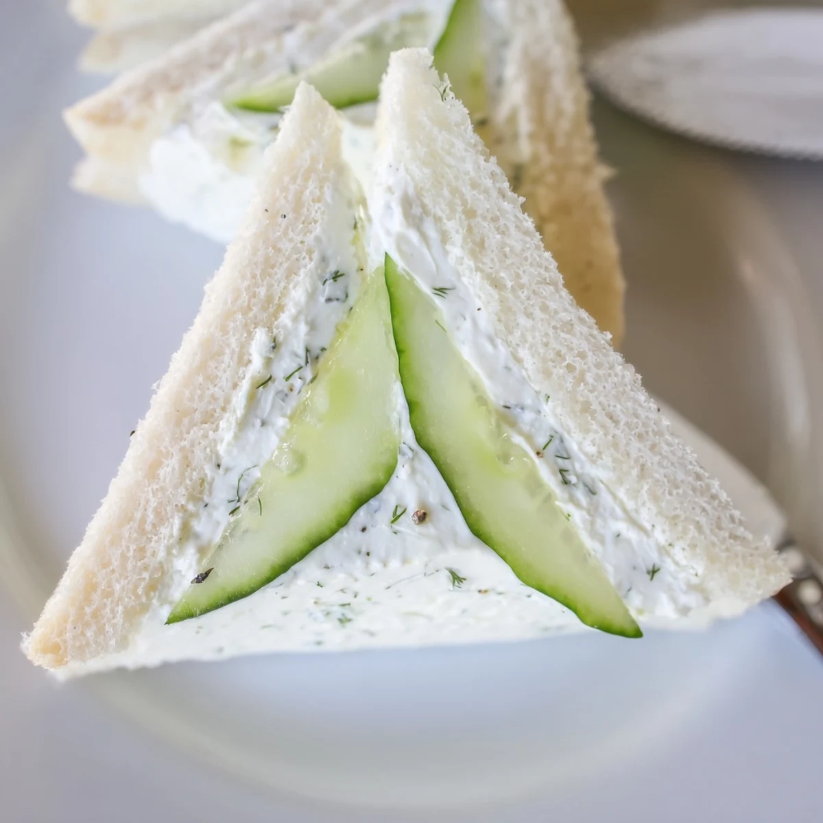 Tea-time Classic Cucumber Sandwiches on soft white bread, thinly sliced cucumbers visible.
