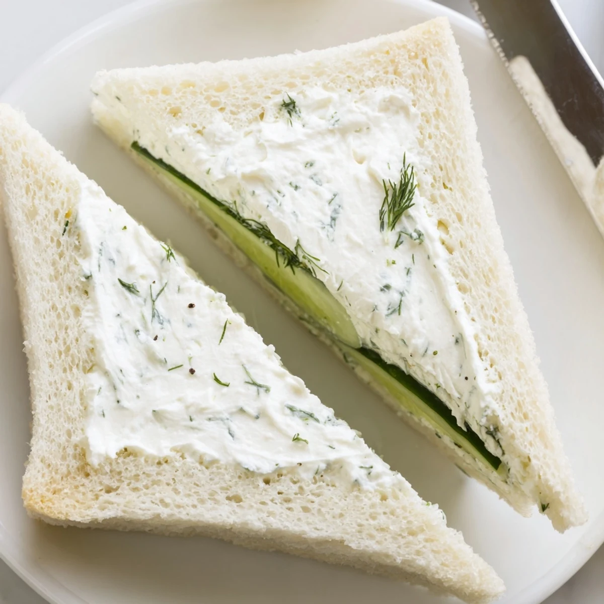 Stacked Classic Cucumber Sandwiches, delicate crustless rectangles, cool refreshing bite recommended.
