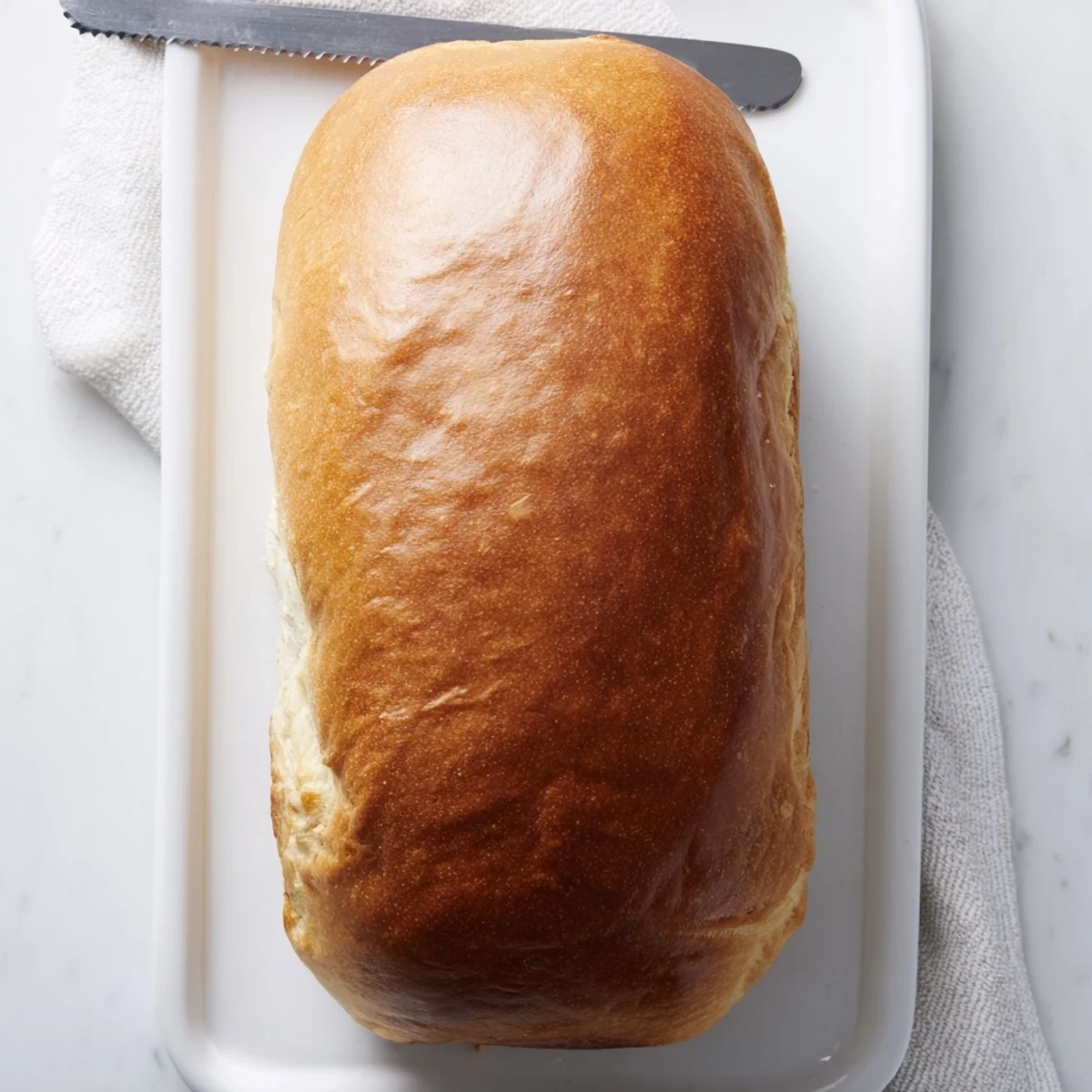 Soft fluffy homemade Amish white bread loaf sliced for sandwiches and breakfast toast