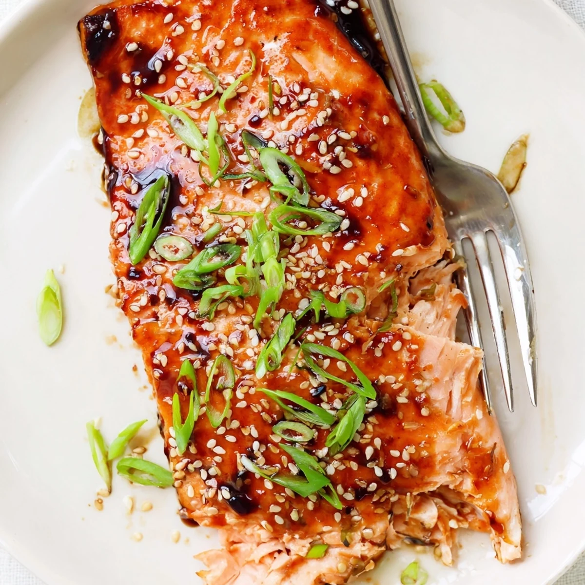 Baked Gluten Free Teriyaki Salmon Recipe plated with steamed rice and scallions