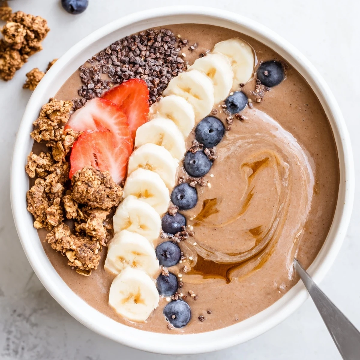Cold, energizing Coffee Protein Smoothie Bowl garnished with cacao nibs and chia