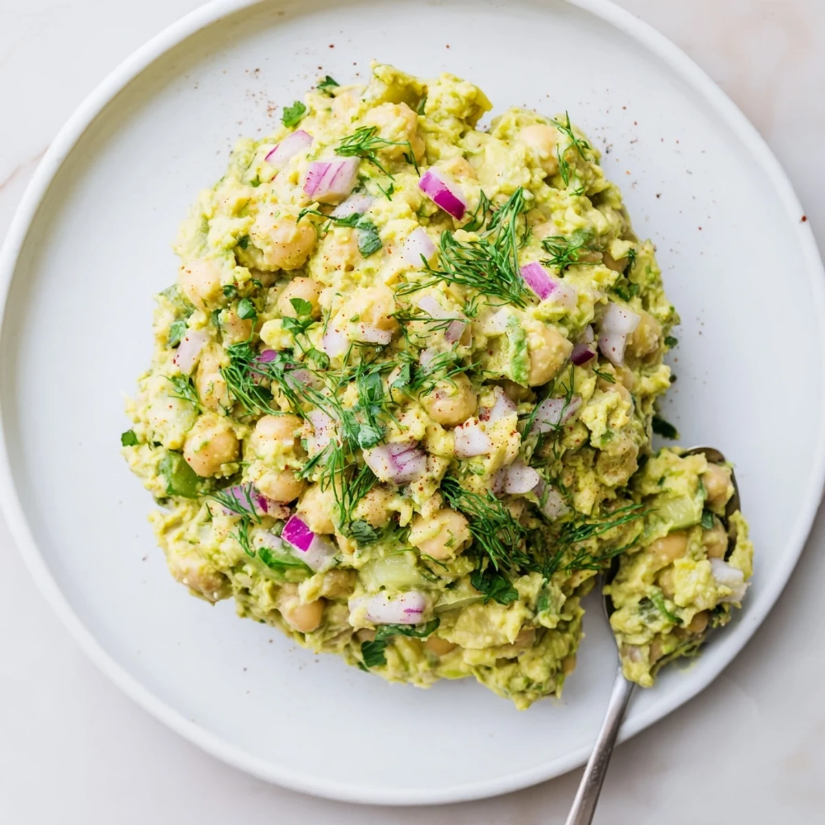 Smashed Chickpea Avocado Pickle piled on toasted sourdough, zesty and creamy